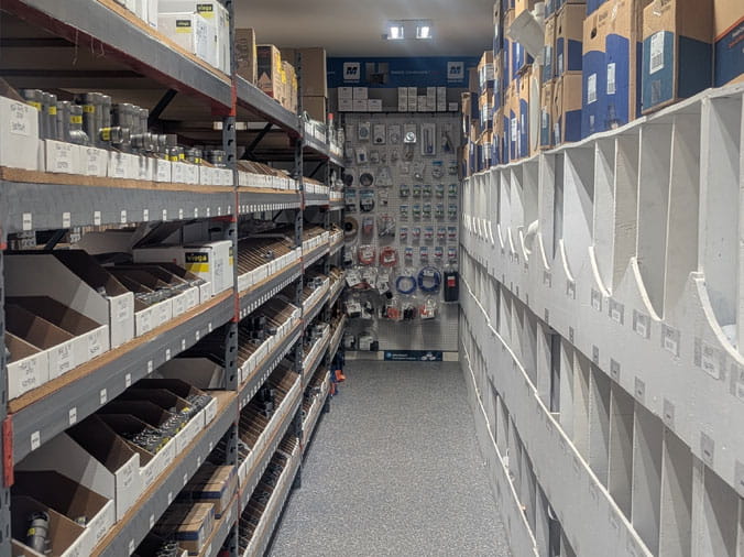 PLumbing supplies on shelves at Bud's Plumbing
