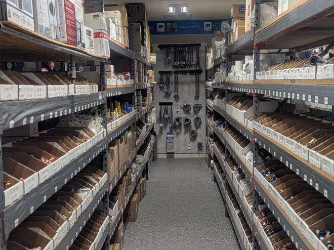 Shelves stocked with plumbing supplies at Bud's Plumbing